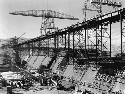 Photograph of Friant Dam under construction, circa 1940. From the Woodward collection.