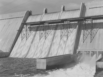 Black and white photograph of a dam waterway from collection.