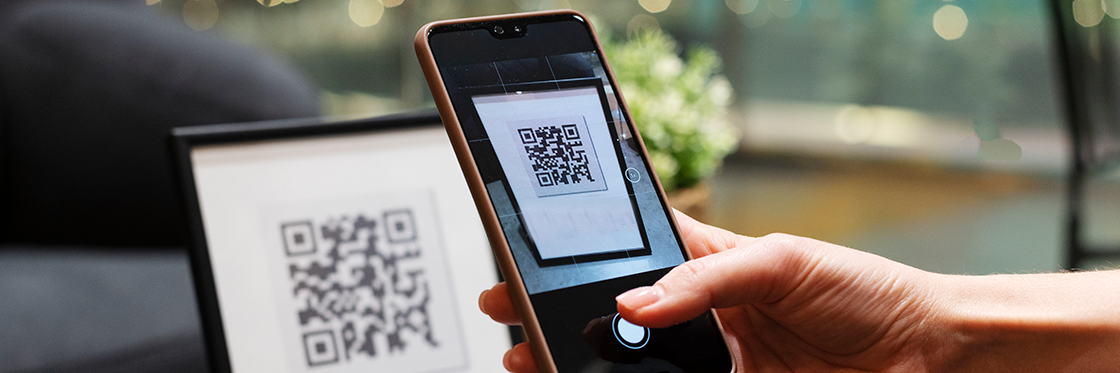 A QR code being scanned by a mobile phone