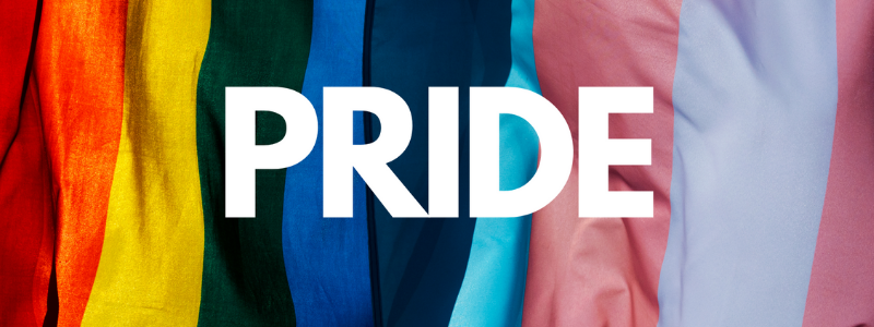 The word Pride on a field of multicolored pride flags
